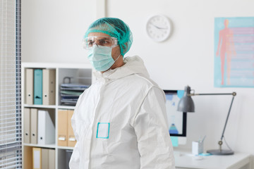 Wall Mural - Male doctor wearing protective clothing standing at the hospital