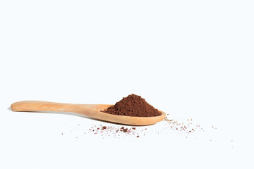 Wall Mural - Coffee powder in a wooden spoon