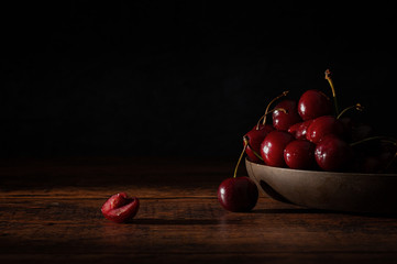 Wall Mural - Fresh Cherries in a Wooden Bowl Dark Food Photograph