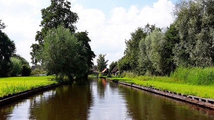 View of a canal in the famous typical Dutch village Giethoorn, called the Venice of the Netherlands or Venice of the North.