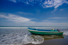 SAME, ECUADOR - MAY 06 2016: Fishing Boat On The Beach In The Sand In A Beautiful Day In With Sunny Weather, Blue Sky In Same, Ecuador