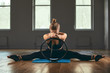 © Georgii - Fitness trainer shows exercises with a rubber expander. Motivation for a beautiful body. Fitness banner, copy space.