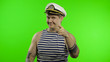 © Andrii Iemelianenko - Young sailor man pointing to camera with hands. Seaman guy in sailor's vest