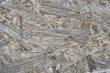 plywood gray color. background texture of aged sheet of plywood with fragments of compressed sawdust