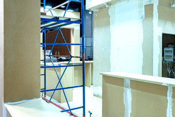 Poster - Renovation in the office space. Installation of partitions. Installation of drywall partitions. Office building renovation. Services of construction teams. Turnkey office finishing.