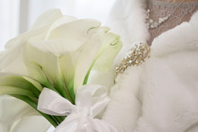 Bouquet Of White Flowers In The Hands Of The Bride. Bride`s Dress And Brooch. Wedding Bouquet