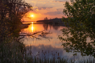 Wall Mural - charming landscape on the river at sunset and night time