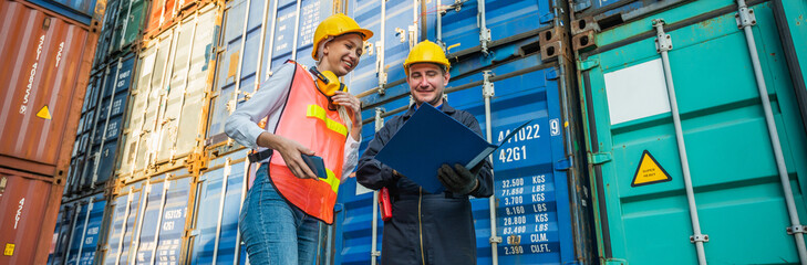 The Problem with Two foreman man & woman worker working checking at Container cargo harbor to loading containers. Dock male and female staff business Logistics import export shipping concept.