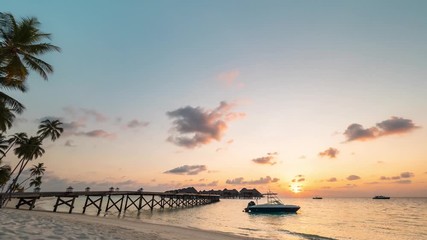 Wall Mural - 4K Timelapse, Maldives sunset from the beach over the jetty