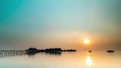 Wall Mural - 4K Timelapse, Maldives sunset over the calm water