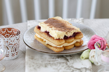 Canvas Print - Traditional italian tiramisu cake on the table.