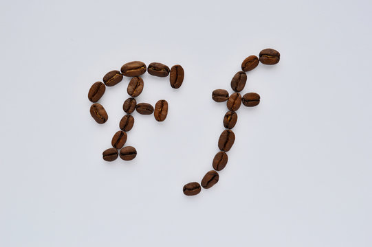 Uppercase letters f made of coffee beans on the white background
