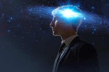 Wall Mural - dreamer, creative mind concept. a man with a galaxy in his head,