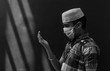 © Abhishek Mittal - Young Muslim boy Praying Namaz by putting Medical Mask on his face to protect from Virus and Germs during Ramazan