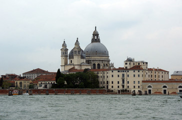 Wall Mural - Cityscape with Santa Maria della Salute church with historical facades and adriatic sea in Venice. View from the adriatic sea