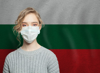 Wall Mural - Young woman wearing a face mask with national flag Bulgaria.  Flu epidemic and virus protection concept