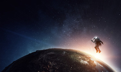 astronaut in space on planet orbit.