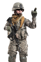 Female in US Army soldier (ISAF) with rifle. Shot in studio. Isolated with clipping path on white background