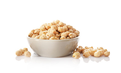 Wall Mural - Chickpeas in small white ceramic bowl isolated on white background.