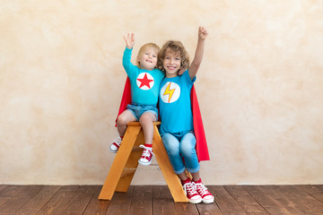 superheroes children playing at home
