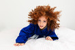 © wtondossantos - Caucasian girl fighting judo. child with curly hair, child playing at home