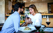 Young man surprised his girlfriend with engagement ring in the restaurant. Lifestyle, love, relationships, food concept