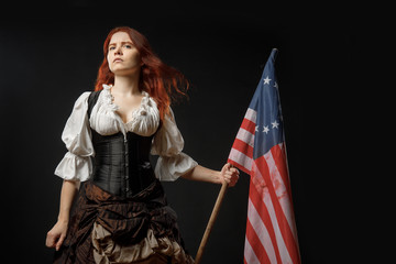 Wall Mural - Girl in historic dress from United States Revolutionary War with flag. July 4th, Independence Day USA Concept Photo Composition