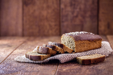 homemade banana cake with oats, on a rustic wooden background. Organic product.