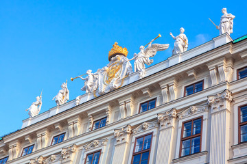 Wall Mural - marble statues at building top in central Vienna