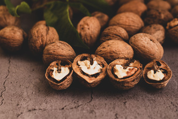 Wall Mural - crushed walnuts and leaves on the table