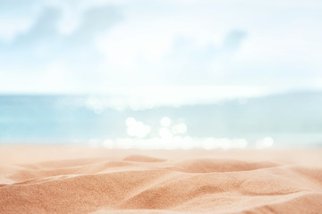 Tropical summer sand beach and bokeh sun light on sea background, copy space.