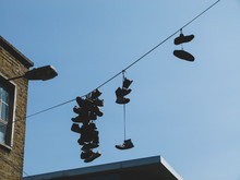 Sneakers And Shoes On A Wire