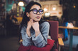© GalakticDreamer - Contemplating ethnic woman relaxing in cozy cafe
