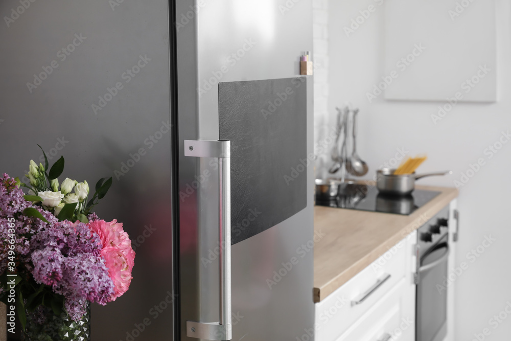 Chalkboard on door of refrigerator in kitchen