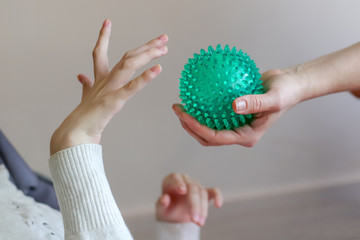 hands of a child with cerebral palsy