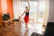 © o_lypa - Ballet girl stretch at home with chair