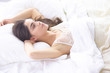 © lenetsnikolai - beautiful young woman basking in bed in the morning. Beautiful Model face looks sexy in camera