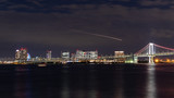 Fototapeta  - 芝浦ふ頭から見たレインボーブリッジとお台場の夜景と飛行機、船の光跡