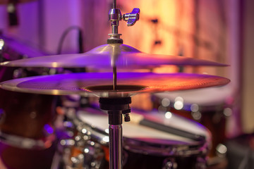 Drums, cymbals, hi hat on a beautiful background in the recording Studio. Room for musicians ' rehearsals. The concept of musical creativity.