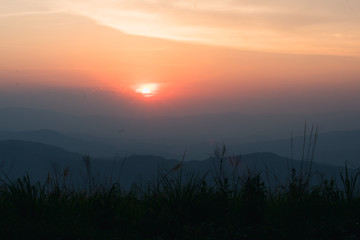 Wall Mural - sunset in the evening with alternating mountains