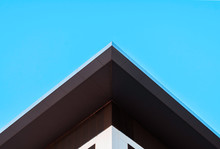 Abstract Symmetry Geometry Minimal Triangular High Building On Blue Sky, Creative Concept Background With Copy Space
