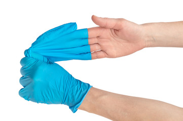 Nurse removing gloves from her hand. Close up. Isolated on white.