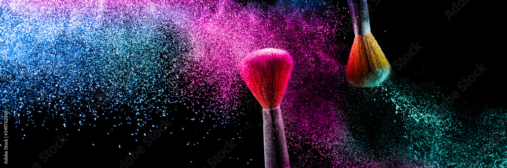Two brushes with pink and blue make up powder impact to make a colorful cloud. - obrazy, fototapety, plakaty 