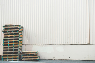 warehouse wall with wooden palet background ready for product display montage.