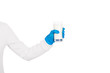 © esvetleishaya - Female hand in disposable glove holds glass of milk or yogurt.