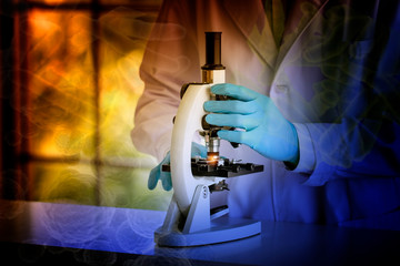 Wall Mural - laboratory concept; colorful shade picture of scientist uses a microscope in the laboratory