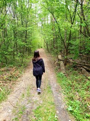 walking girl in the woods