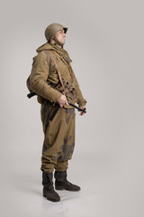 Wall Mural - Actor man in an old military uniform and camouflage clothing of a soldier of the Soviet army during the World War II