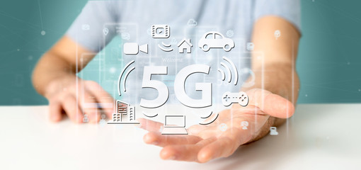 Poster - businessman holding a 5g connection with data surrounding - 3d rendering