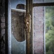 old rusty window in abandoned building